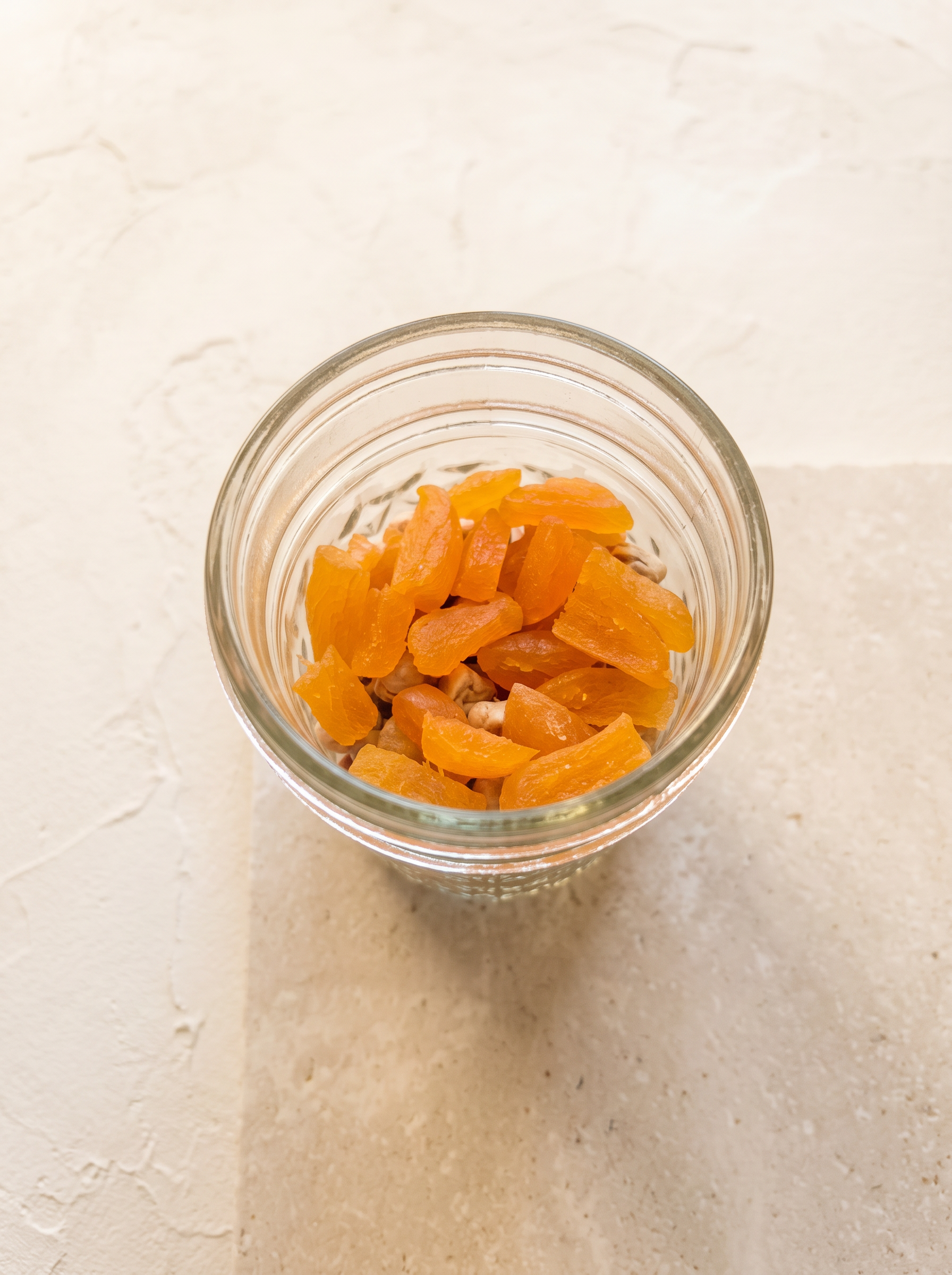 Top view of dried apricots and chickpeas in the Moroccan Couscous jar